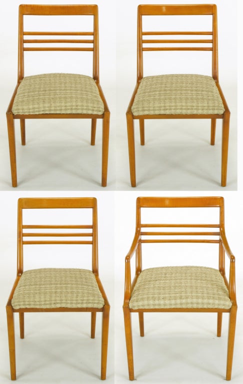 Clean lined set of 4 bleached walnut dining chairs by Renzo Rutili for Johnson Furniture. The three sides chairs and single armchair have three curved and rounded edged back cross bars and the front legs have klismos style tops. Tactile silk and