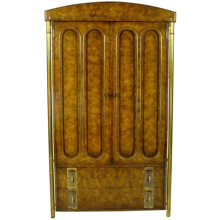 This neoclassical wardrobe cabinet was made by Mastercraft for Charak Furniture, the legendary Boston furniture company that once featured modern designs by Tommi Parzinger. In the mid-1960s, Charak ceased its own production due to labor