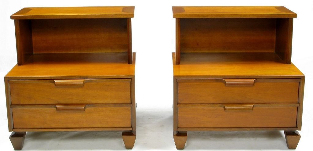 Inverse obelisk feet, and carved pulls are the focal points of this pair of bedside tables by Tomlinson. Open storage above, with one drawer below.