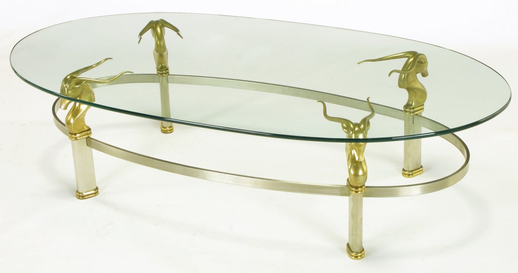 Late 20th Century Brushed Stainless Oval Coffee Table With Brass Gazelle Heads For Sale