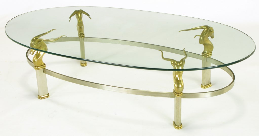 Fin du 20e siècle Table basse ovale en acier inoxydable brossé avec têtes de gazelles en laiton en vente