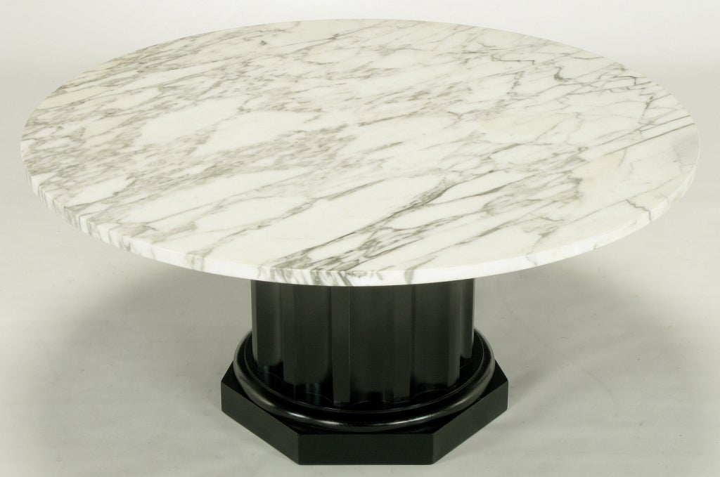 Round white carrera marble top coffee table with a neoclassical fluted wood column base, restored.