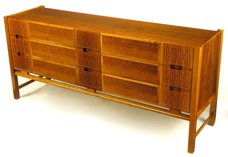 Swedish teak wood long dresser with figural wood and carved panels to the six-drawer fronts. Recessed top with four square post legs and double side stretchers. Front stretcher and top side stretchers are carved while the lower side stretchers are