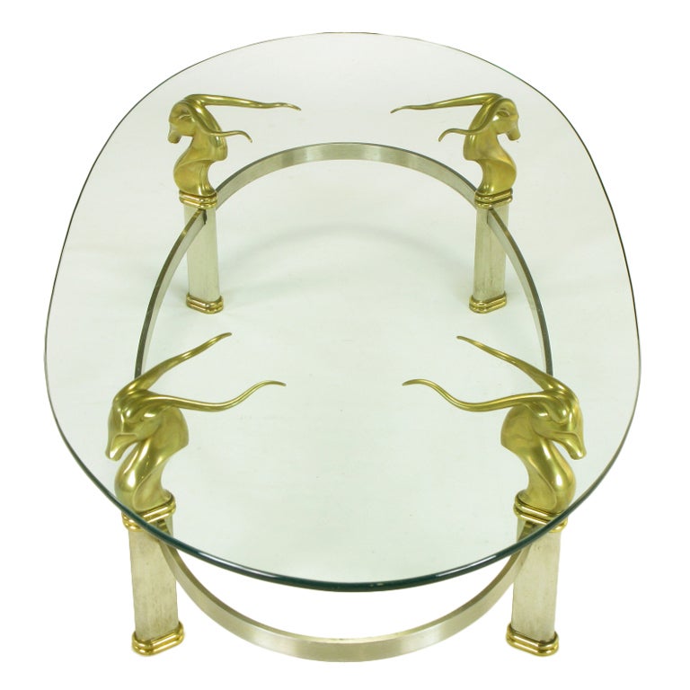 Brushed Stainless Oval Coffee Table With Brass Gazelle Heads For Sale