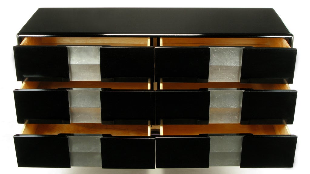 John Van Koert for Heywood Wakefield six drawer dresser or credenza. Complete restoration, updated to ebonized and silver leafed finish. Six drawers feature inset scalloped panels finished in silver leaf. Radius edged cabinet is supported by four
