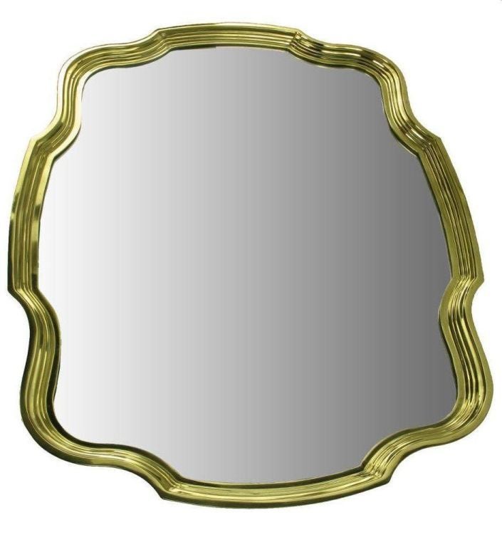 Regency styling and solid stepped brass frame create a striking wall mirror.