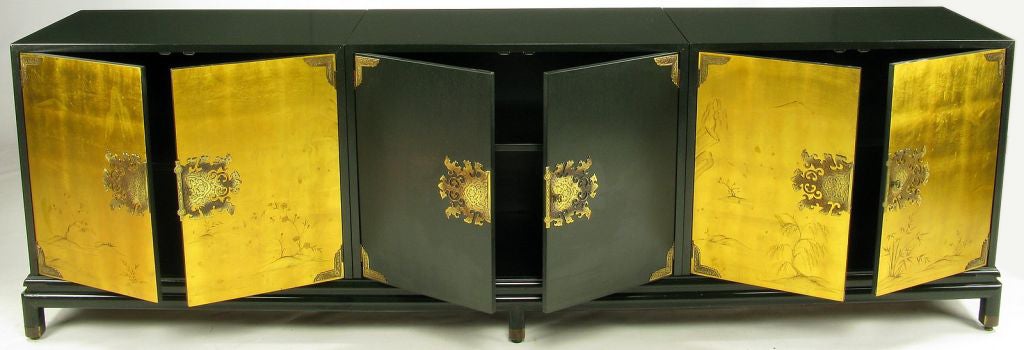 Designed by Renzo Rutili for Johnson Furniture, and comprised of three separate cabinets on a single base, this sideboard or credenza is extraordinary. The two outer cabinets have gilded door fronts with hand painted Asian decoration.



The