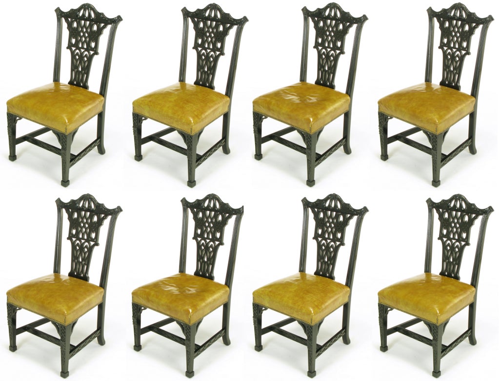 Set of eight early Century Chair Company transitional dining chairs. Influenced by George III and Chinese Chippendale styles with straight front legs with closed fretwork and carved panels to the side and center stretchers. Sienna toned leather Seat