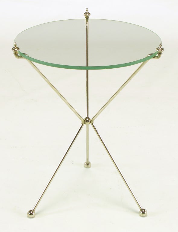 Bent brass rod French directoire style tripod table with glass top. Three finials fasten the glass into place, center brass ball and brass ball feet.
