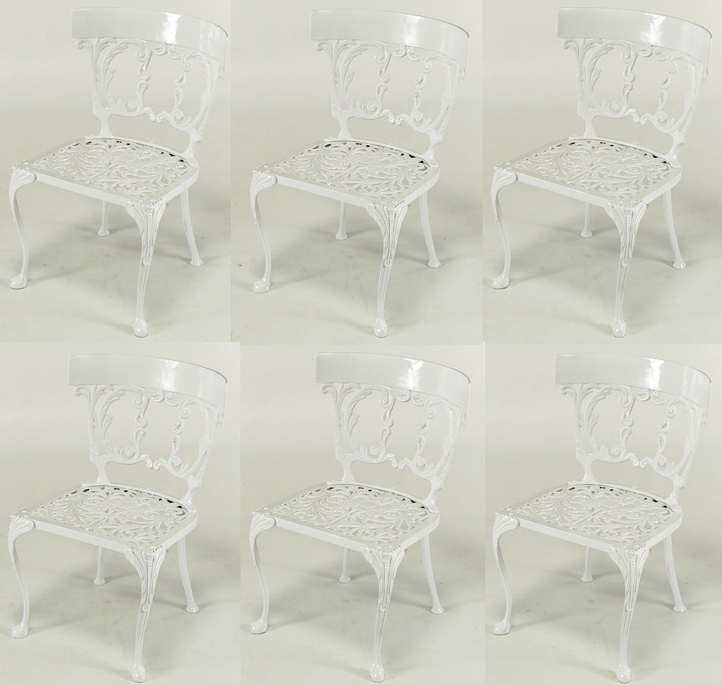 Set of six cast aluminum and white enameled French regency style dining chairs. Fresh white enamel over finely cast aluminum for which Molla was renowned.