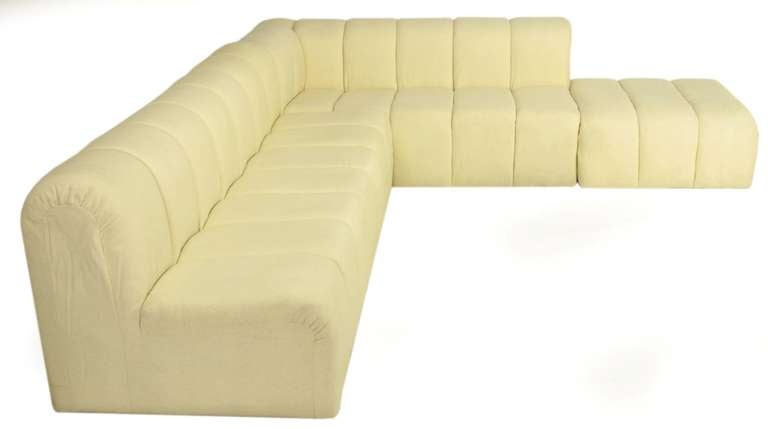 Substantial ivory wool front and back channeled sectional sofa consisting of three pieces; armless section - 32