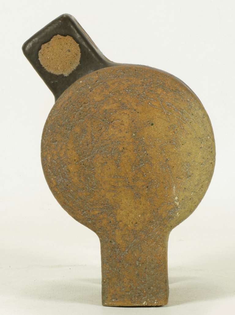 Glazed terra cotta abstract modern sculpture by Tomiya Matsuda. Identical form in triplicate. Outside sections function as the legs as well as body. Inside section is juxtaposed and parcel glazed with dotted center.

Tomiya Matsuda (1939-2011)