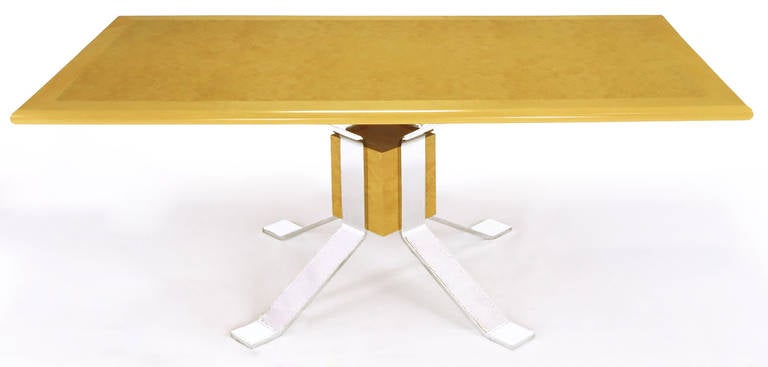 Rectangular Pace collection dining table with very thick chrome-plated steel legs buttressing a central square burled olive wood block. Burled olive wood top with maple border.