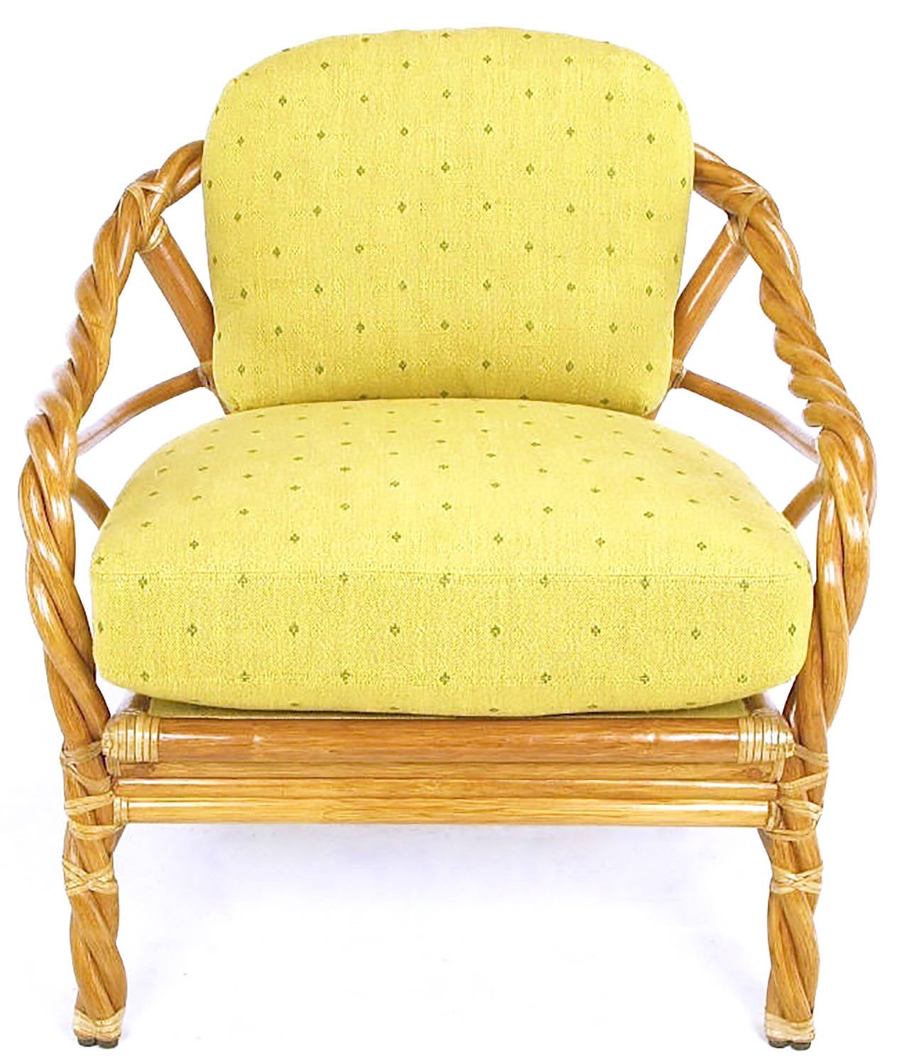 Made of twisted and bent rattan wrapped and joined with real rawhide, this vintage McGuire arm chair comes with saffron yellow patterned twill upholstery. The back cushion is down filled and the seat is very high grade foam.