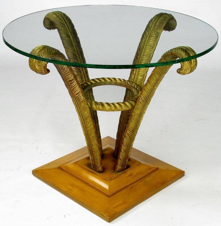 Excellent pair of original condition Grosfeld House side tables with lacquered square plinth base and four carved wood and patinated gilt plumes. Also features a lower glass tier and 1/2