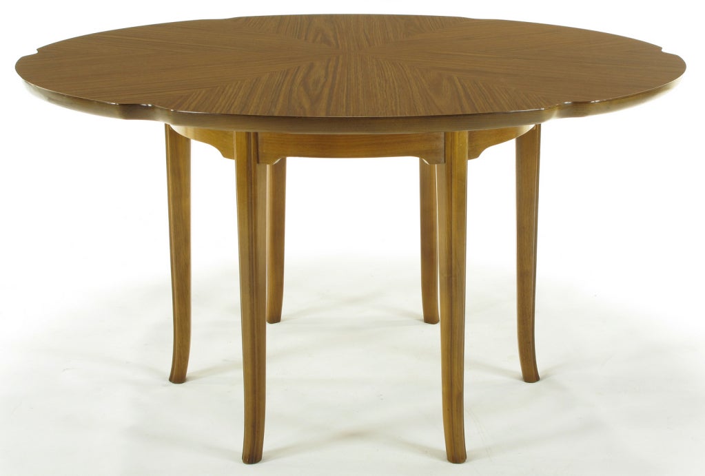 Mahogany saber leg game table with parquetry laminate scalloped top. Six incised edge legs separated by a six part bracketed apron. Beautiful laminate top is perfect for a game table or low breakfast table, impermeable to liquids and free from white
