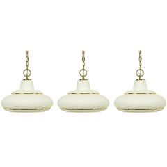 Three White Opal Glass 
Brass Pendant Lights