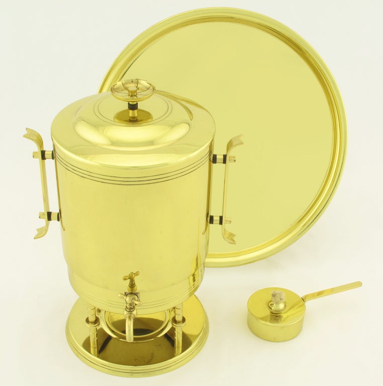Brass urn with valved spout for coffee or hot water designed by Tommi Parzinger for Dorlyn Silversmiths. Many Parzinger signature flourishes are present, such as three incised rings to the top of the urn, ribbon handles, and top incised finial.