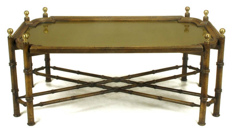 Chinese Chippendale coffee table with removable tray. Carved oak frame of faux bamboo is distressed and patinated, carved oak tray has inset brass top. Brass ball finials. Made in Spain.