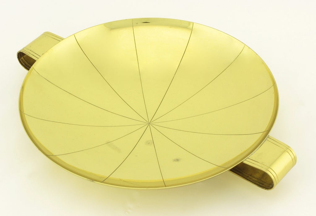 Tommi Parzinger for Dorlyn brass candy dish with double incised looped handles. Incised sunburst patterned dish raised on a small circular base.