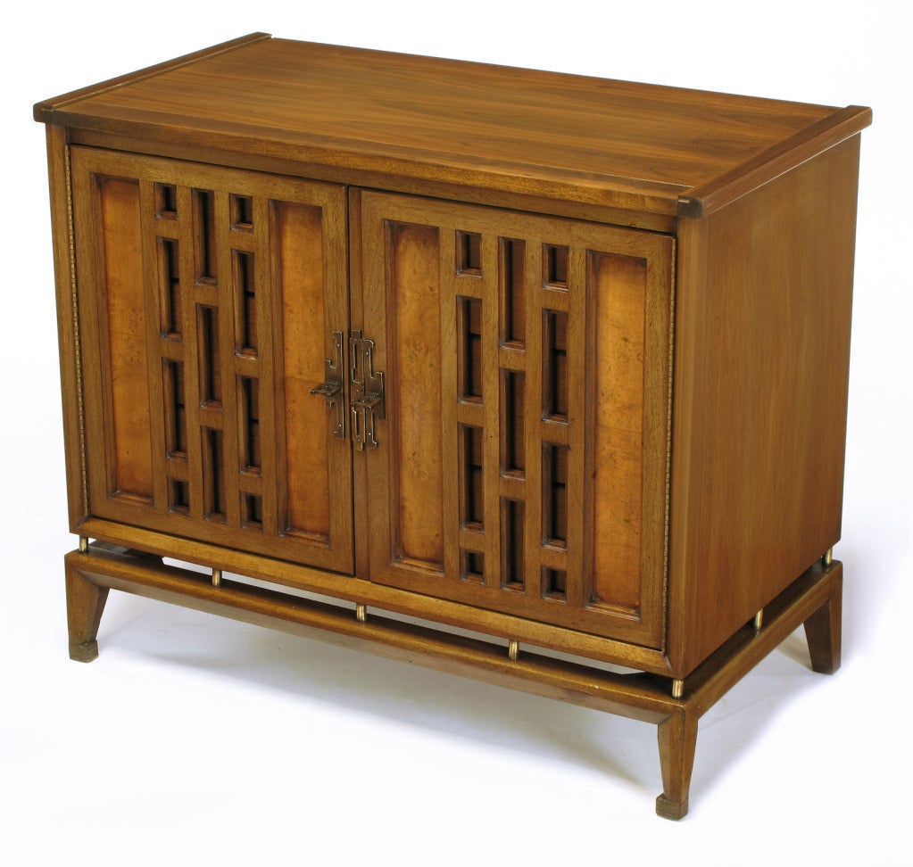 Pair of walnut cabinets with floating cabinets and open fretted doors by White Furniture. Each cabinet door has open fret work panels and burled wood recessed panels with Asian inspired, patinated brass pulls and escutcheons. Doors open to reveal