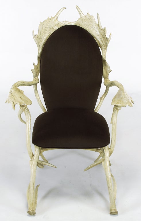 Arthur Court arm chair constructed of cast and lacquered aluminum moose antlers. The lacquering was masterfully executed as the realism is remarkable. Dark chocolate brown velvet upholstery on the seat and back is new.  

arm height 26.5