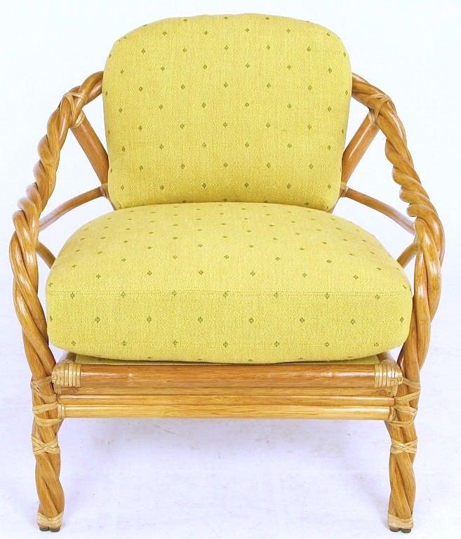 Made of twisted and bent rattan wrapped and joined with real rawhide, this vintage McGuire arm chair comes with saffron yellow patterned twill upholstery. The back cushion is down filled and the seat is very high grade foam.