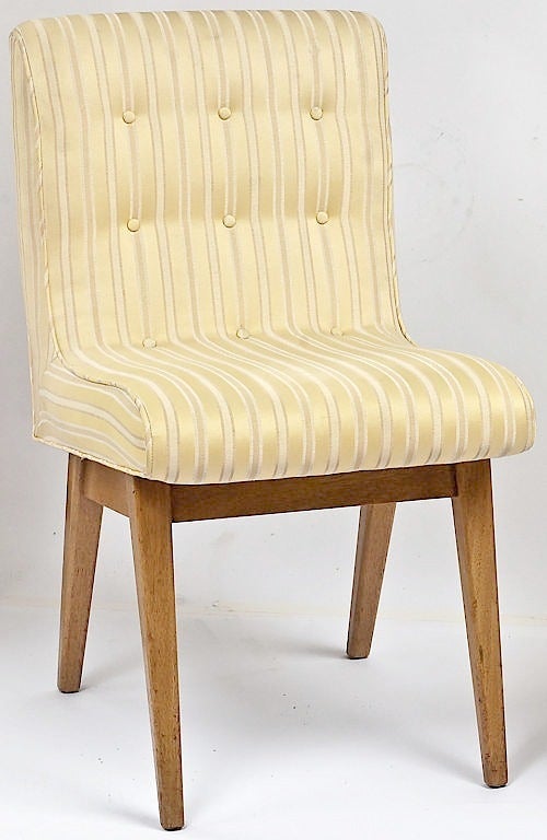 Pair of button tufted side or slipper chairs with upholstered one piece seat that curves into the back. Bleached mahogany wood bases. Striped ivory and white silk upholstery is original. Uncommon base design with the tapered legs and apron situated