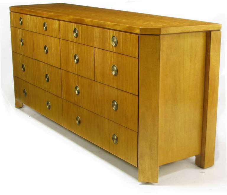 Beautifully grained honey colored prima vera mahogany with flush concentric circled brass pulls. Canted corners with recessed sides and parquetry top. See our listings for the tall dresser from this collection.

In a fall 1989 review of the High