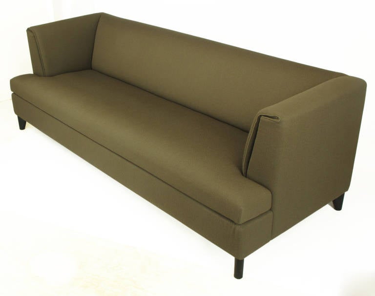 Wittmann sofa with uncommon tight cushions by Austrian designer furniture manufacturer Wittmann. Notice how the arm cushions while fixed, fold over the set back arm revealing a single welt. Perfect for entertaining, as tight seat cushions do not