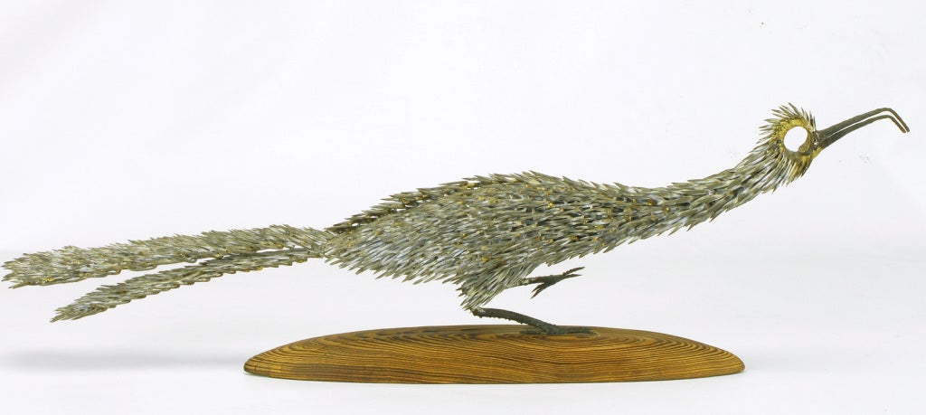Incredibly detailed and heavy metal sculpture of a roadrunner bird by Forrest Dozier (1921-2011), a self-taught Carlsbad, New Mexico artist.  Dozier, who never completed high school, was a gunner in the Army Air Corps in Southeast Asia during World