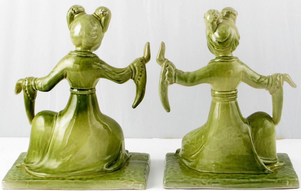 Pair of dancing geshia book ends in ceramic with jade green glazing. Made in Italy for Grow and Cuttle, a decorative arts importer that is now defunct.