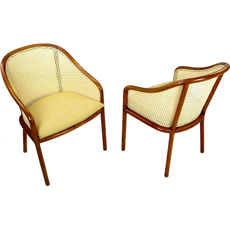 Updated design of the classic arm chair by Ward Bennett for Brickel Associates. The frame is a lovely grained golden oak and the back and sides are new woven cane. Comes with newly upholstered gold linen seat pads.