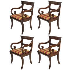 Four Regency Scrolled Arm Dining Chairs