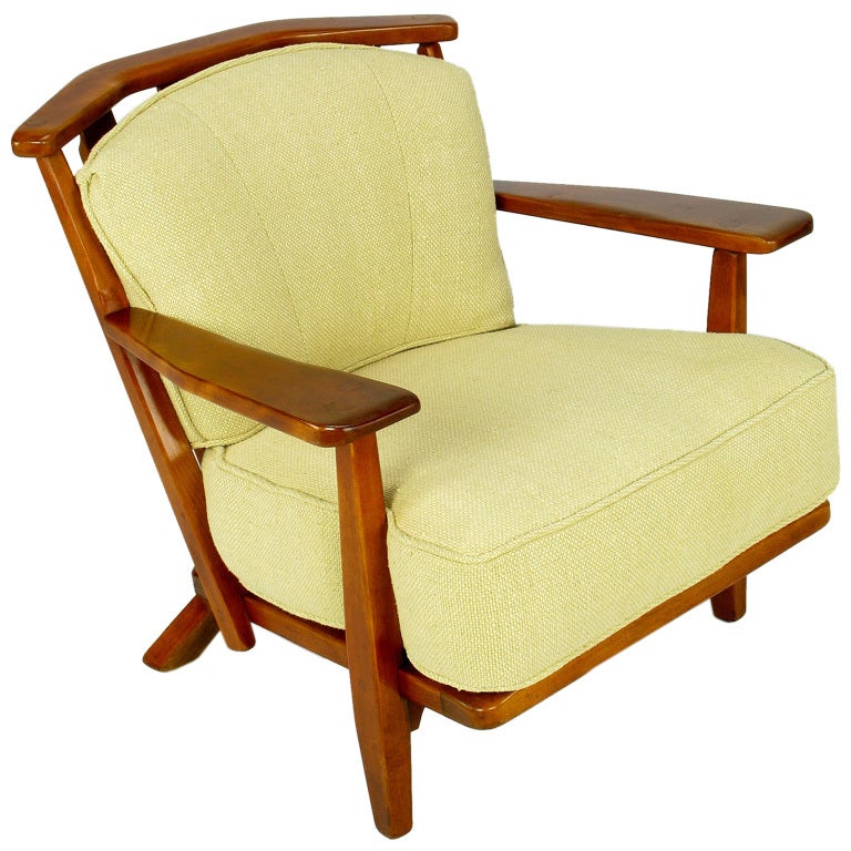 A wonderfully comfortable colonial revival club chair from custom furniture maker Cushman Colonial of Vermont. The red rock maple wood Adirondack-style frame is stained a warm mahogany. Two cushions are newly clad in a mesh backed loose weave cotton