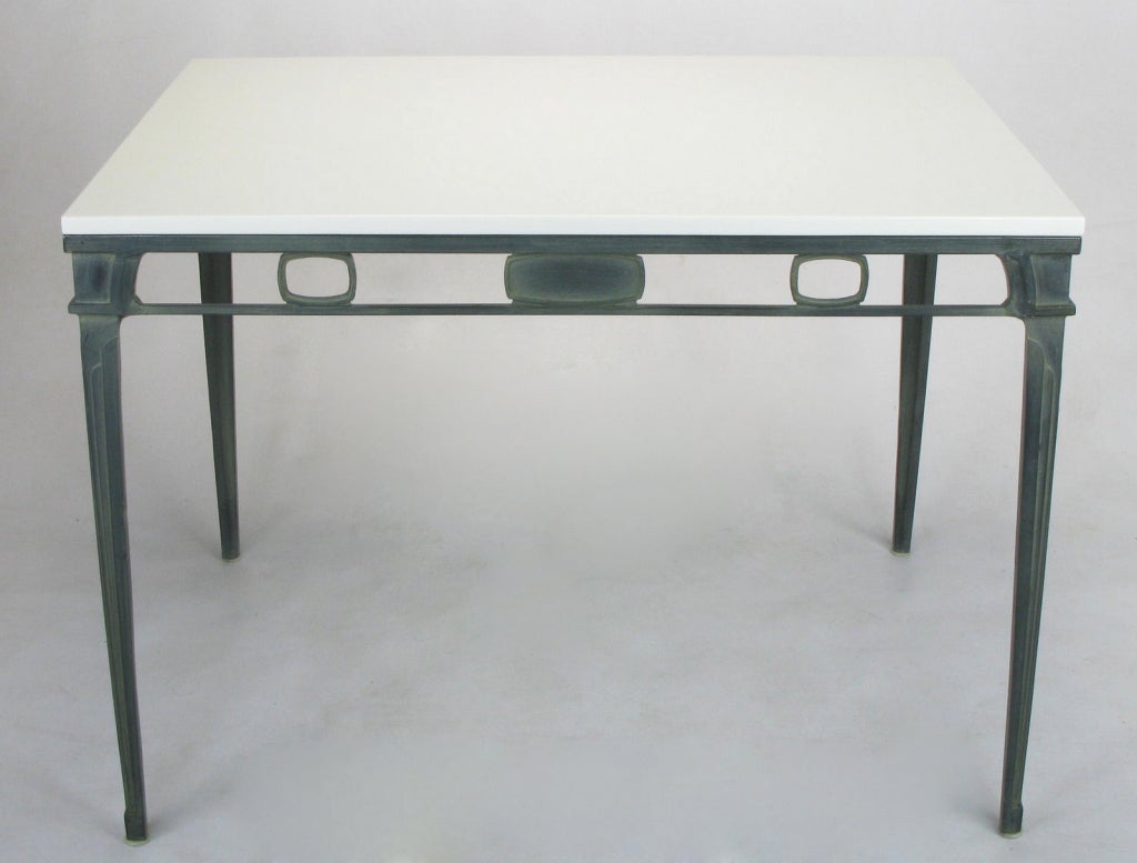 Cast and lacquered aluminum art deco inspired petite dining table. Verdigris lacquered finish has the look of patinated bronze. White porcelain top is more durable and stain-resistant than the Thassos marble from which it is inspired, yet has the