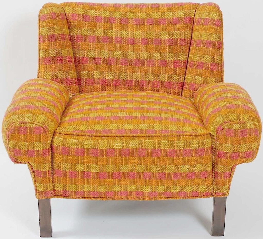 Rare pair of Paul Laszlo for Herman Miller lounge chairs circa 1948. Original checked nubby wool upholstery in very good condition, a pleasing mix of orange, magenta, and gold. Legs of dark wood.