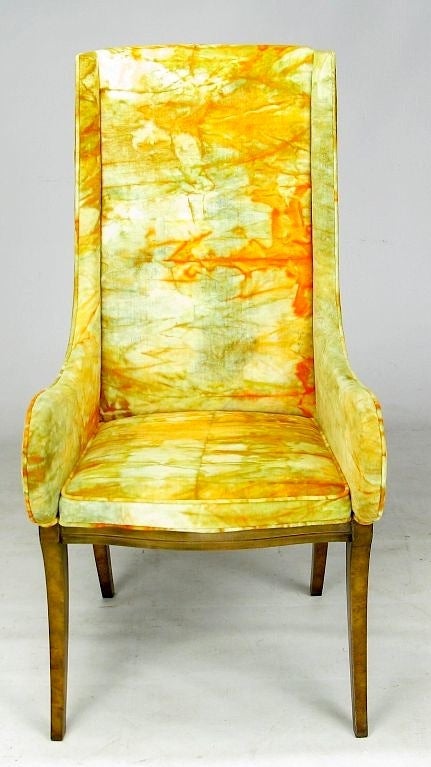 hese chartreuse and tangerine tie-dyed velvet (a la Jack Lenor Larsen) arm chairs have an updated Italian Modern style with rich burl walnut stylized klismos-type legs. Designed by William Doezema for Mastercraft.