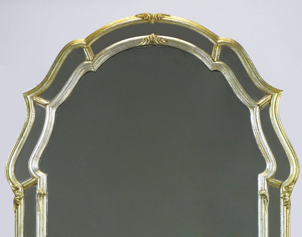 La Barge double framed carved wood and gesso Italian wall mirror. Patinated silver leaf with gold tones and black speckled detail. Made in Italy.