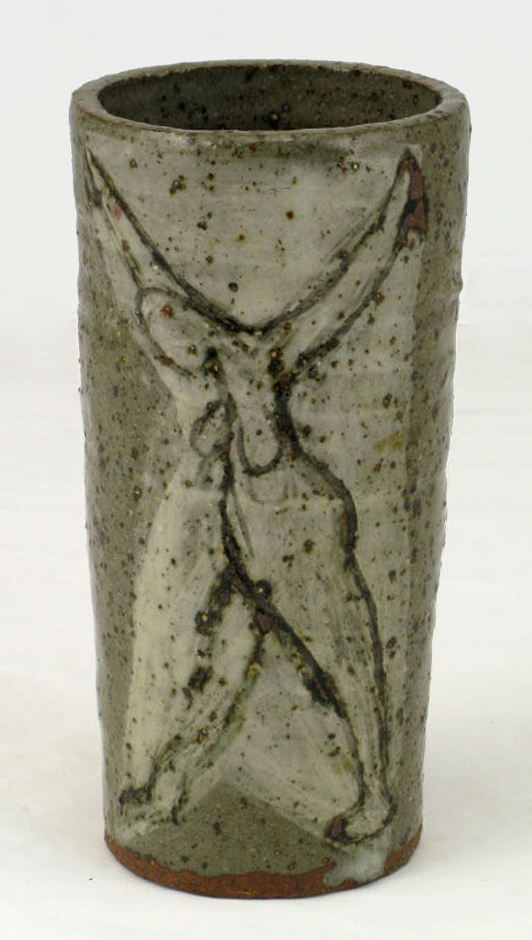 Very nice petite vase in hand thrown pottery with a variegated gray, glaze depicting nude and open armed women to each side. Signed 