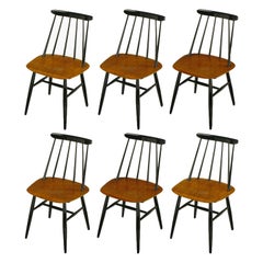 Six Ilmari Tapiovaara Teak and Black Lacquer Dining Chairs