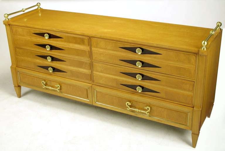 Empire style large six-drawer long chest with cast heavy brass rosette pulls to the upper four drawers and a pair of lower drawers with brass inlaid borders and heavy solid brass scrolled pulls. Brass ball and rod side gallery. Completely restored