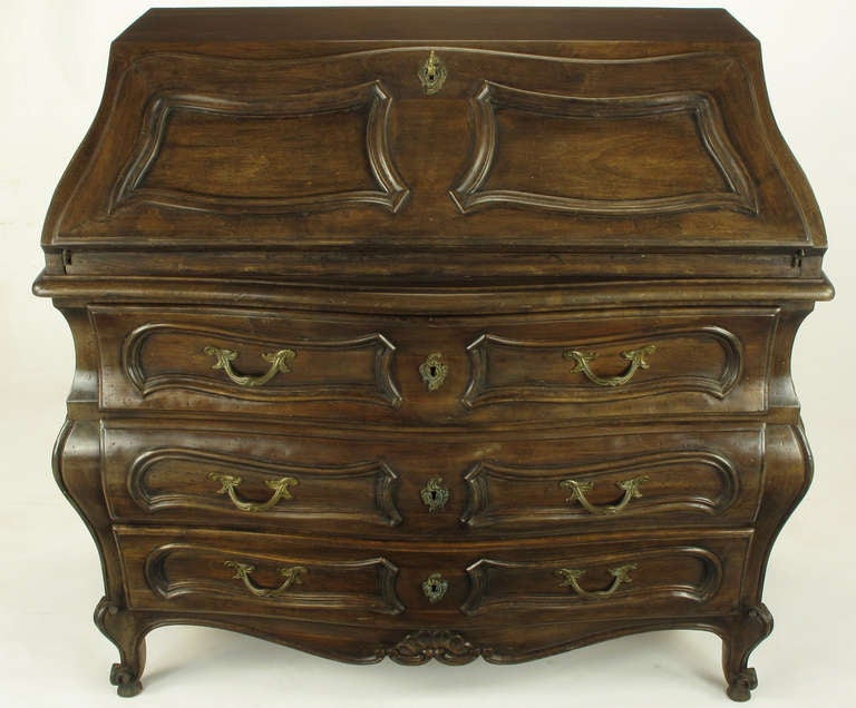 Italian drop front Louis XV style bombe secretary/chest with three drawers. Brass Rococo pulls and escutcheons with a pair of keys that function. Drawers retain the original book paper lining. Signed V.G. made in Italy on back.