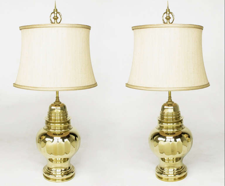 Very uncommon early Chapman cast brass ginger jar lamps, circa 1950s. Original double socket clusters are rewired. Sold with custom shades and armillary style finials.