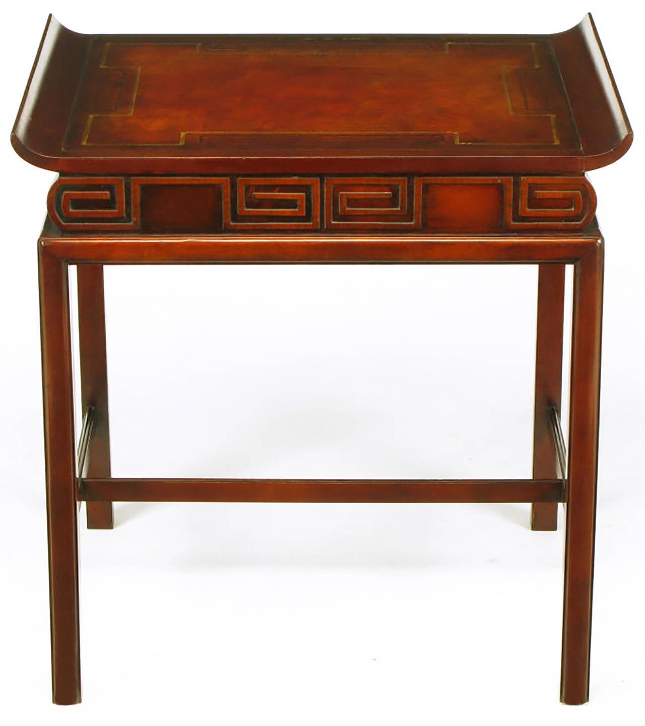 Asian inspired side tables with curved edge tops and tooled leather inlay. The fronts and finished backs have Greek key carved recesses. Three part lower stretchers and incised border legs.