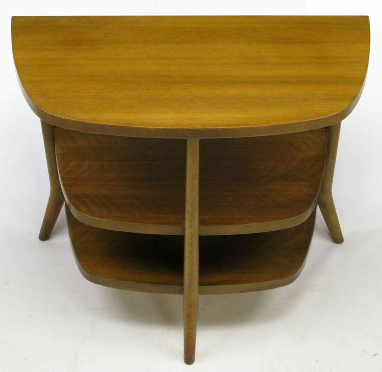 Clean lined and subtle Italian detail with unique design, this walnut three-tier, tri-legged demilune end table from Bertha Schaefer for Singer & Sons has been completely restored.