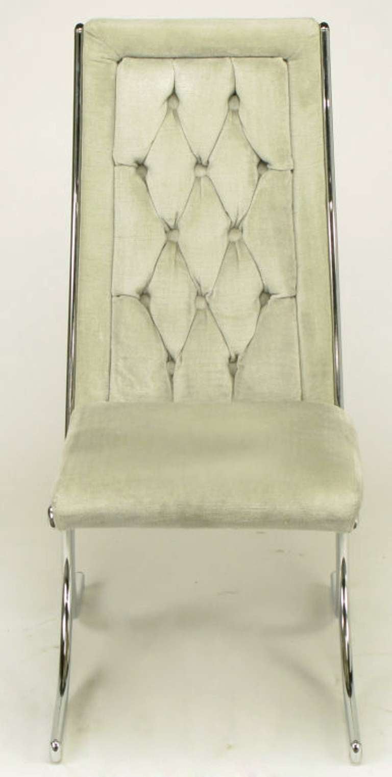 Set of four chromed metal and gray diamond button tufted velvet dining chairs by the Howell Co., a St. Charles, Illinois manufacturer of chrome metal furniture, most famous for its art deco designs by Wolfgang Hoffmann. Howell closed operations in
