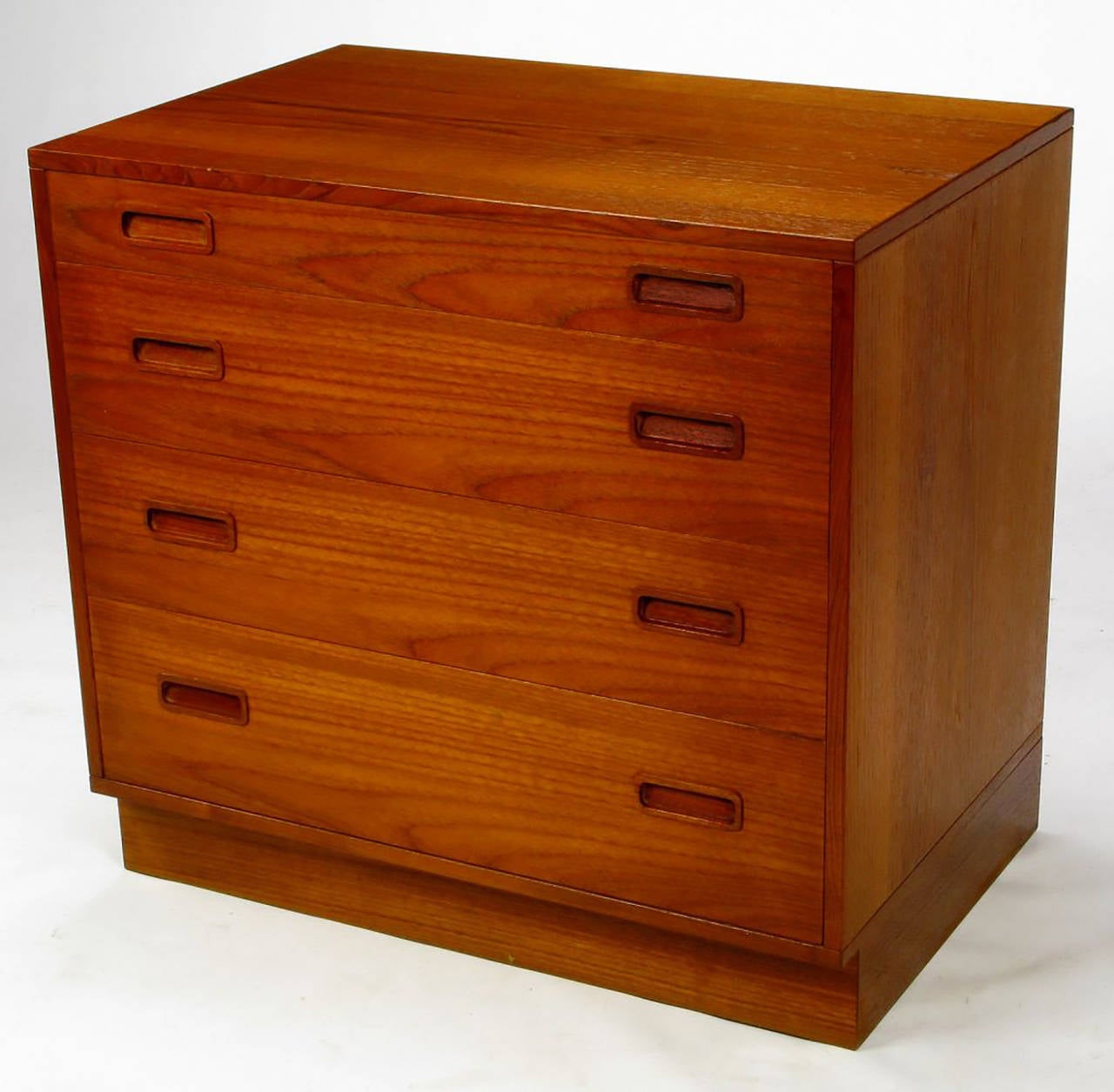 Simple and clean lined, these teakwood commodes or small chests by Danish designer Poul Hundevad could work as large bedside tables or placed side by side and used as a long and low dresser. The inset pulls are made of carved rosewood and the backs