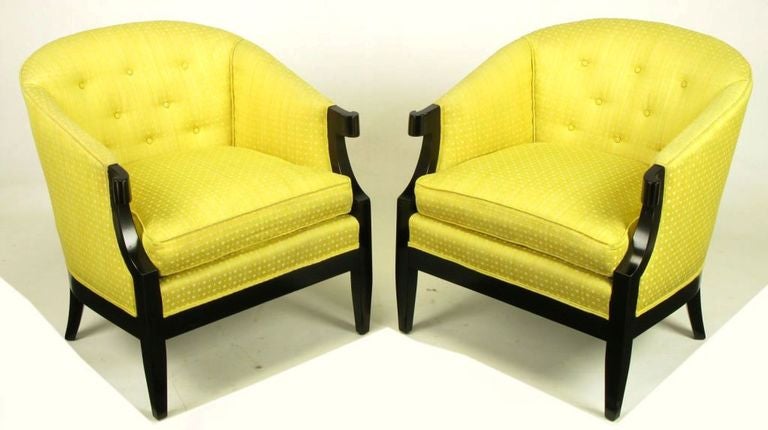 Designed by Winsor White and William Millington for Baker's 1954 Continental Collection, these arm chairs are upholstered in a vintage yellow embroidered silk fabric, with refinished ebonized walnut frames with turned arms and tapered front and back