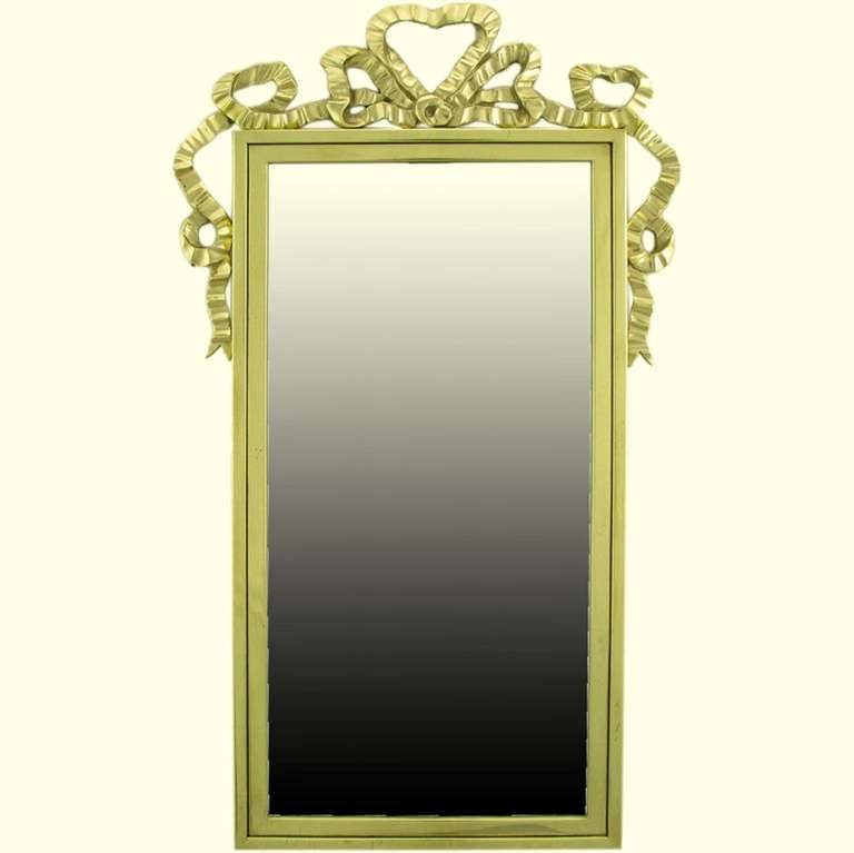 Classically and elegantly designed solid brass mirror, framed with ribbon fold swags. Italian import, marketed thru Decorative Crafts Inc., an exclusively 